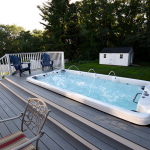 Vita Spa swim spa on a garden deck