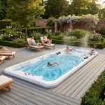 Vita Spa swim spa in a landscaped garden